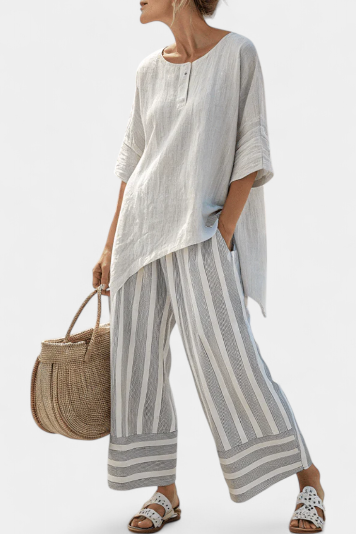 Talvora | Elegante blusa asimétrica y pantalones de rayas