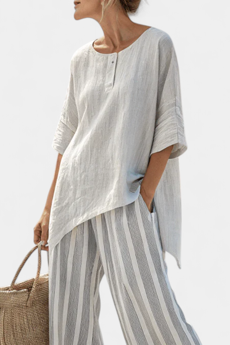 Talvora | Elegante blusa asimétrica y pantalones de rayas
