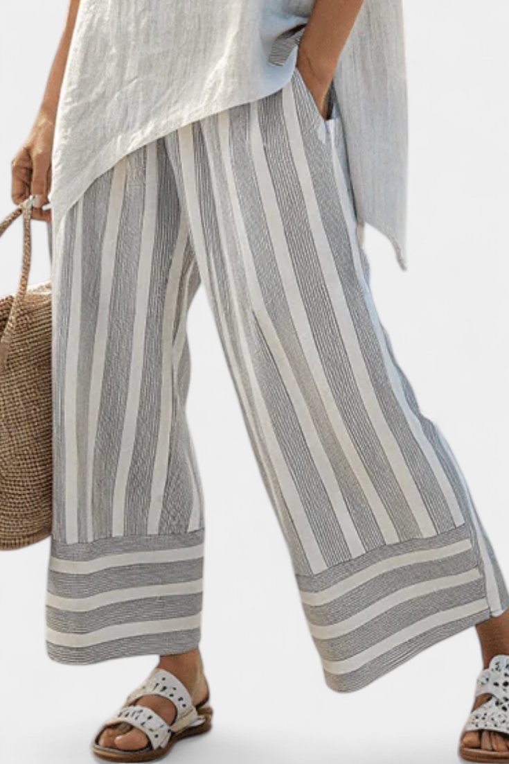 Talvora | Elegante blusa asimétrica y pantalones de rayas