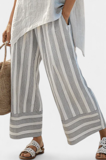 Talvora | Elegante blusa asimétrica y pantalones de rayas