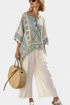 Quinley | Blusa estampada cómoda y pantalones blancos de pierna ancha
